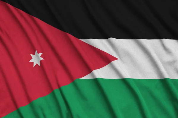 Jordan flag  is depicted on a sports cloth fabric with many folds. Sport team waving banner