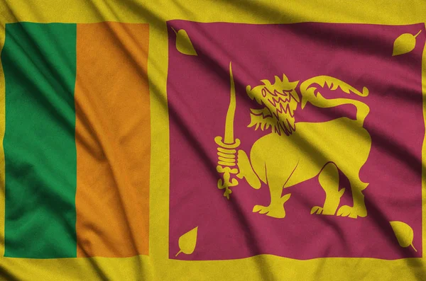 スリランカの旗は多くの襞とスポーツの布生地に描かれています スポーツ チームを振ってバナー — ストック写真