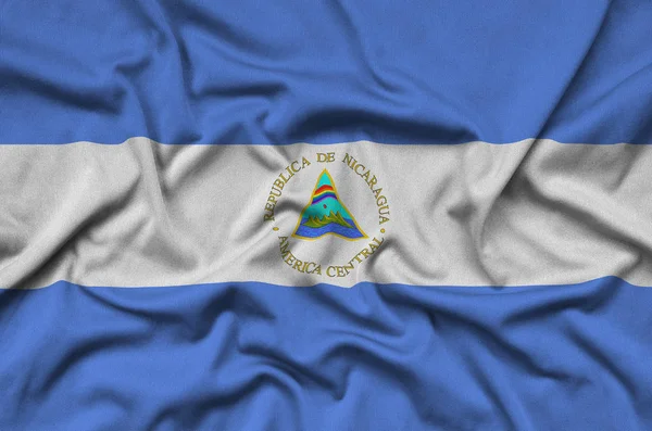 Флаг Никарагуа Изображён Спортивной Ткани Множеством Складок Спортивная Команда Размахивает — стоковое фото