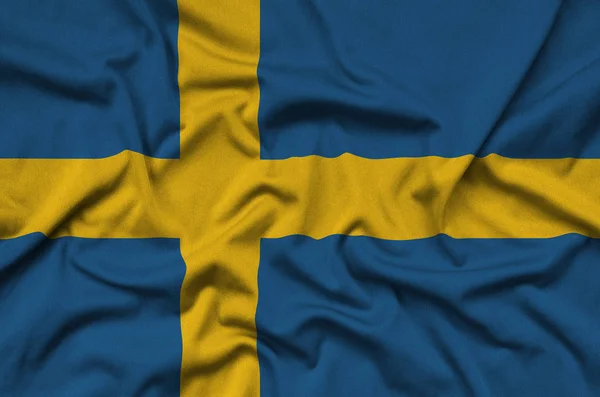 Flaga Szwecji Jest Przedstawiony Materiał Tkaniny Sportowe Dużo Chętnych Transparent — Zdjęcie stockowe