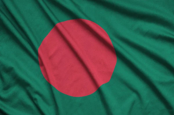 Bangladesh flag  is depicted on a sports cloth fabric with many folds. Sport team waving banner