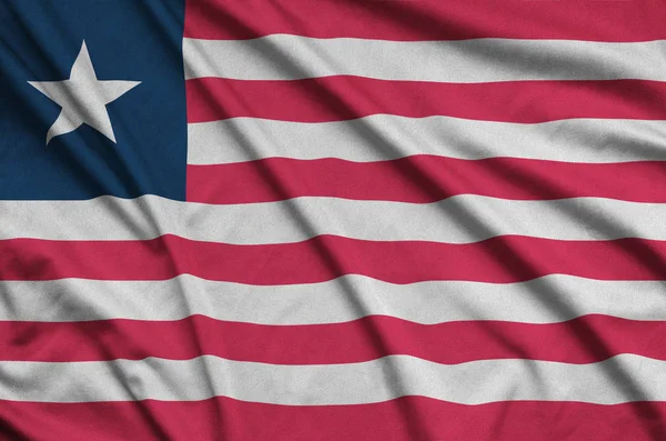 Liberya bayrağı ile birçok çiziklere spor bez kumaş üzerinde tasvir edilmiştir. Spor takım sallayarak afiş