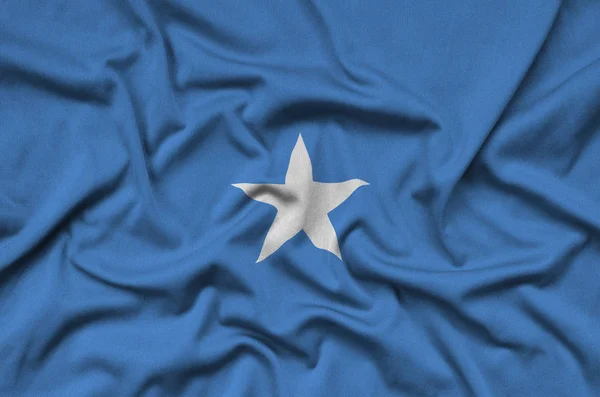 索马里国旗被描绘成有许多褶皱的运动布织物 运动队挥舞旗帜 — 图库照片