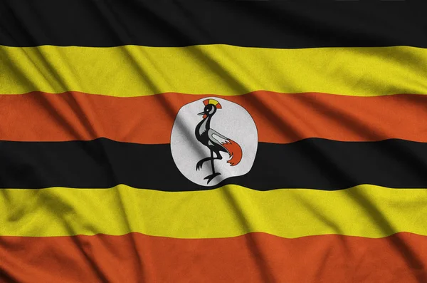 Die Flagge Ugandas Ist Auf Einem Sportstoff Mit Vielen Falten — Stockfoto