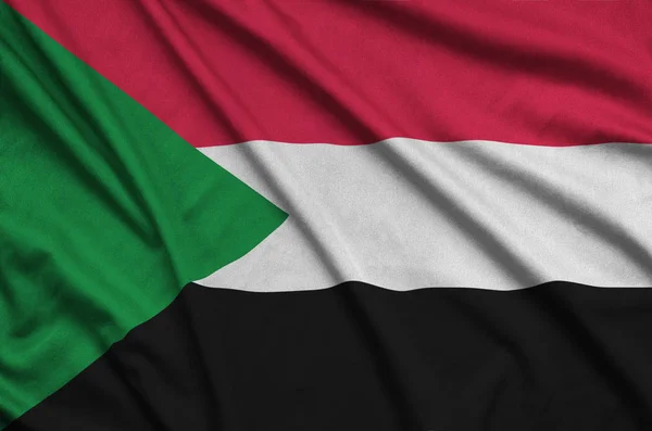 Bandeira Sudão Representada Tecido Tecido Esportivo Com Muitas Dobras Esporte — Fotografia de Stock