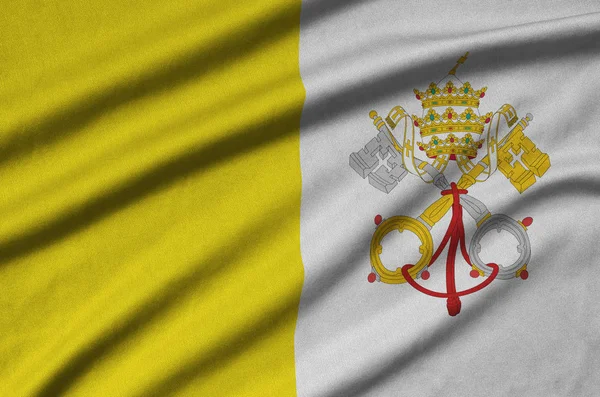 Vatikan Devlet bayrağı ile birçok çiziklere spor bez kumaş üzerinde tasvir edilmiştir. Spor takım sallayarak afiş