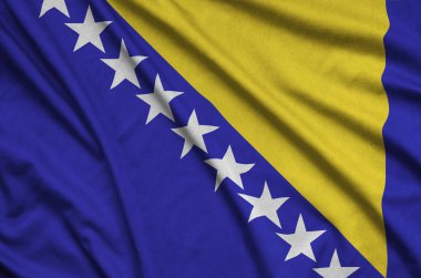 Bosna-Hersek bayrağı ile birçok çiziklere spor bez kumaş üzerinde tasvir edilmiştir. Spor takım sallayarak afiş
