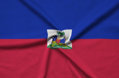 Haiti bayrağı ile birçok çiziklere spor bez kumaş üzerinde tasvir edilmiştir. Spor takım sallayarak afiş