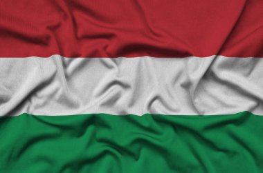 Macaristan bayrağı ile birçok çiziklere spor bez kumaş üzerinde tasvir edilmiştir. Spor takım sallayarak afiş