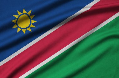 Namibya bayrağı ile birçok çiziklere spor bez kumaş üzerinde tasvir edilmiştir. Spor takım sallayarak afiş