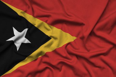 Timor Leste bayrağı ile birçok çiziklere spor bez kumaş üzerinde tasvir edilmiştir. Spor takım sallayarak afiş