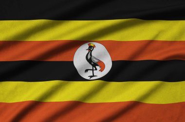 Uganda bayrağı ile birçok çiziklere spor bez kumaş üzerinde tasvir edilmiştir. Spor takım sallayarak afiş