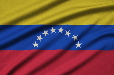 Venezuela bayrağı ile birçok çiziklere spor bez kumaş üzerinde tasvir edilmiştir. Spor takım sallayarak afiş