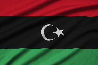 Libya bayrağı ile birçok çiziklere spor bez kumaş üzerinde tasvir edilmiştir. Spor takım sallayarak afiş