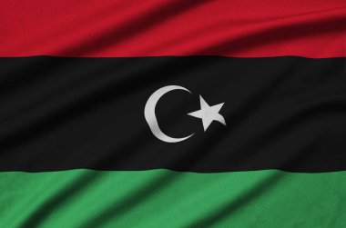 Libya flag  is depicted on a sports cloth fabric with many folds. Sport team waving banner clipart