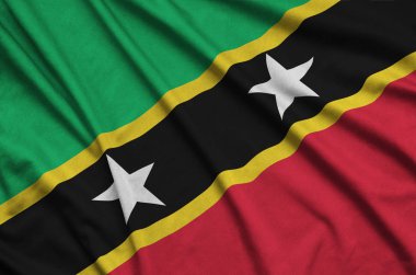 Saint Kitts ve Nevis bayrak birçok çiziklere ile spor bez kumaş üzerinde tasvir edilmiştir. Spor takım sallayarak afiş