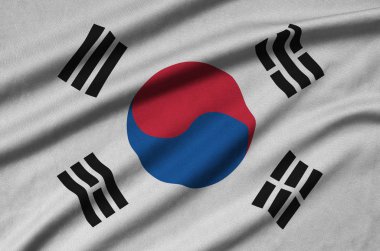 Güney Kore bayrağı ile birçok çiziklere spor bez kumaş üzerinde tasvir edilmiştir. Spor takım sallayarak afiş