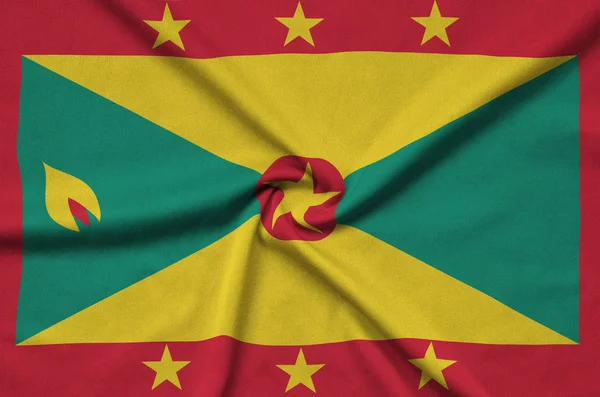 Die Grenada Flagge Ist Auf Einem Sportstoff Mit Vielen Falten — Stockfoto