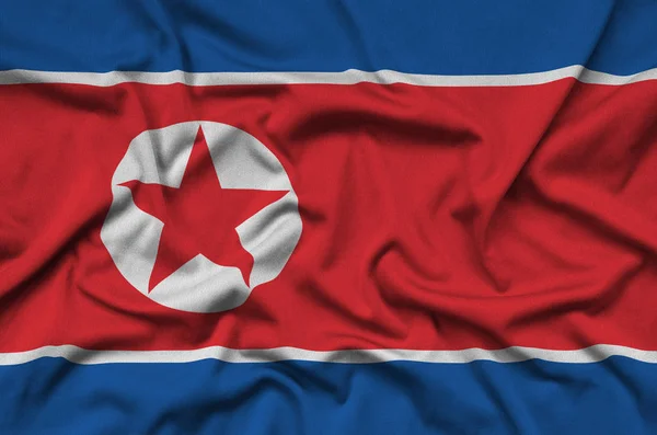 Kuzey Kore Bayrağı Ile Birçok Çiziklere Spor Bez Kumaş Üzerinde — Stok fotoğraf
