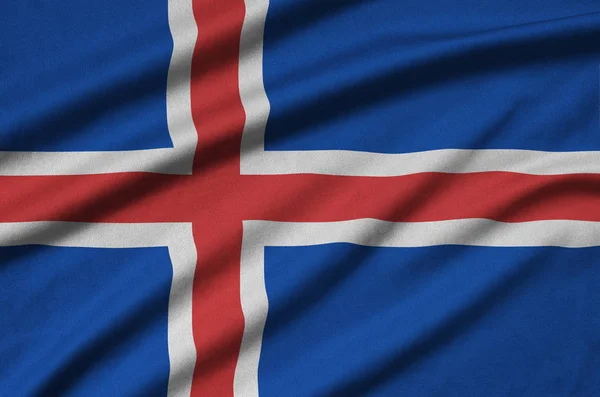 Iceland flag  is depicted on a sports cloth fabric with many folds. Sport team waving banner