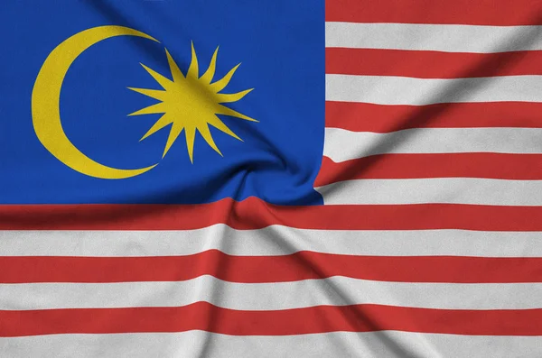 Flaga Malezji Jest Przedstawiony Materiał Tkaniny Sportowe Dużo Chętnych Transparent — Zdjęcie stockowe
