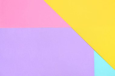 Doku arka planını moda pastel renkler. Pembe, mor, sarı ve mavi geometrik desen kağıtları. en az soyut.