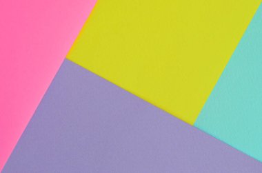 Doku arka planını moda pastel renkler. Pembe, mor, sarı ve mavi geometrik desen kağıtları. en az soyut.