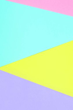 Doku arka planını moda pastel renkler. Pembe, mor, sarı ve mavi geometrik desen kağıtları. en az soyut.