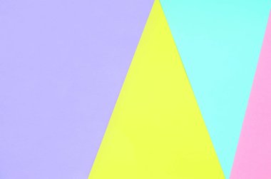 Doku arka planını moda pastel renkler. Pembe, mor, sarı ve mavi geometrik desen kağıtları. en az soyut.