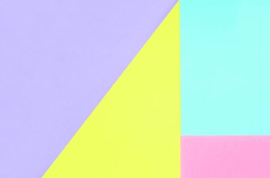 Doku arka planını moda pastel renkler. Pembe, mor, sarı ve mavi geometrik desen kağıtları. en az soyut.