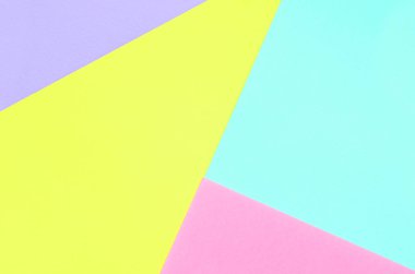 Doku arka planını moda pastel renkler. Pembe, mor, sarı ve mavi geometrik desen kağıtları. en az soyut.