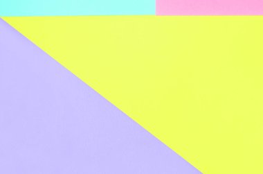 Doku arka planını moda pastel renkler. Pembe, mor, sarı ve mavi geometrik desen kağıtları. en az soyut.