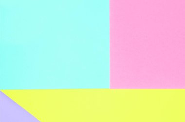 Doku arka planını moda pastel renkler. Pembe, mor, sarı ve mavi geometrik desen kağıtları. en az soyut.