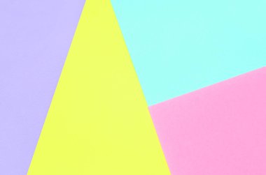 Doku arka planını moda pastel renkler. Pembe, mor, sarı ve mavi geometrik desen kağıtları. en az soyut.