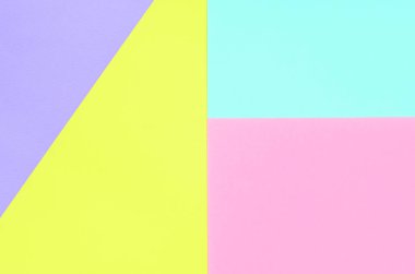 Doku arka planını moda pastel renkler. Pembe, mor, sarı ve mavi geometrik desen kağıtları. en az soyut.