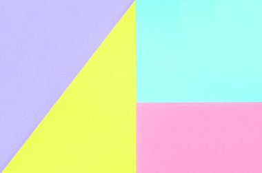 Doku arka planını moda pastel renkler. Pembe, mor, sarı ve mavi geometrik desen kağıtları. en az soyut.