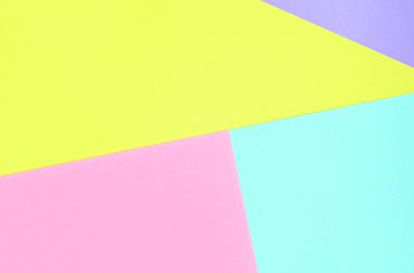 Doku arka planını moda pastel renkler. Pembe, mor, sarı ve mavi geometrik desen kağıtları. en az soyut.