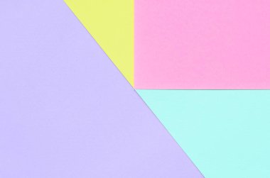 Doku arka planını moda pastel renkler. Pembe, mor, sarı ve mavi geometrik desen kağıtları. en az soyut.
