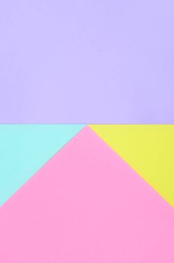 Doku arka planını moda pastel renkler. Pembe, mor, sarı ve mavi geometrik desen kağıtları. en az soyut.