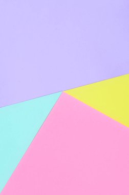 Doku arka planını moda pastel renkler. Pembe, mor, sarı ve mavi geometrik desen kağıtları. en az soyut.