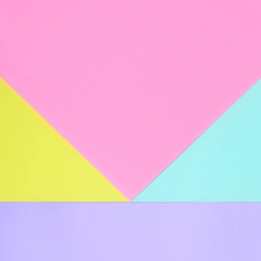 Doku arka planını moda pastel renkler. Pembe, mor, sarı ve mavi geometrik desen kağıtları. en az soyut.