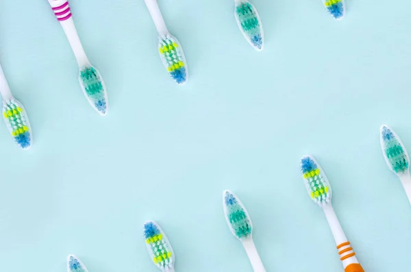 Lot Toothbrushes Lie Pastel Blue Background Top View Flat Lay — Stock Photo, Image