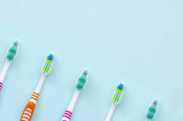 Lot Toothbrushes Lie Pastel Blue Background Top View Flat Lay — Stock Photo, Image