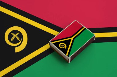Vanuatu bayrağını büyük bir bayrak üzerinde yatıyor bir kibrit kutusu üzerinde resimde.