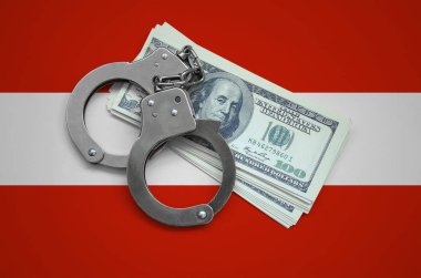 Kelepçe ile Avusturya bayrağı ve a bohça-in dolar. Ülkenin para birimi bozulması. Mali suçlar.