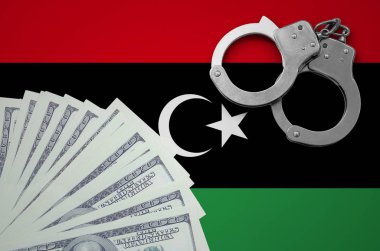 Libya bayrağı ile kelepçe ve a bohça-in dolar. Yasadışı Döviz Alım işlemlerinde bize bankacılık kavramı.