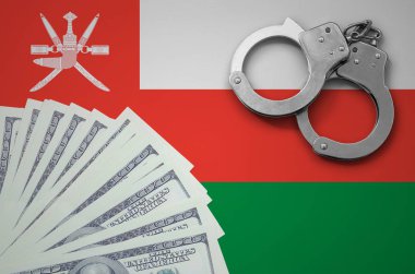 Kelepçe ile Umman bayrağı ve a bohça-in dolar. Yasadışı Döviz Alım işlemlerinde bize bankacılık kavramı.