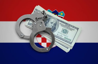 Hırvatistan bayrağı ile kelepçe ve a bohça-in dolar. Ülkenin para birimi bozulması. Mali suçlar.