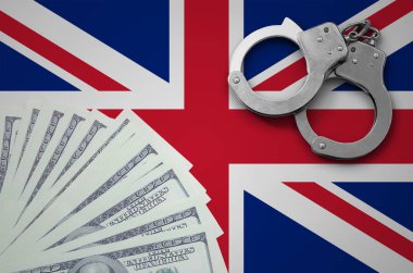 Kelepçe ile Büyük Britanya bayrağı ve a bohça-in dolar. Yasadışı Döviz Alım işlemlerinde bize bankacılık kavramı.