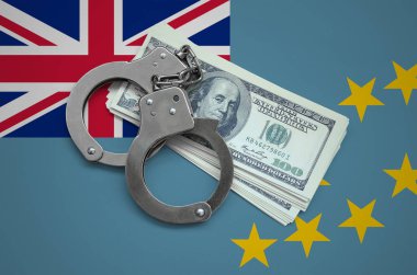 Kelepçe ile Tuvalu bayrağı ve a bohça-in dolar. Ülkenin para birimi bozulması. Mali suçlar.